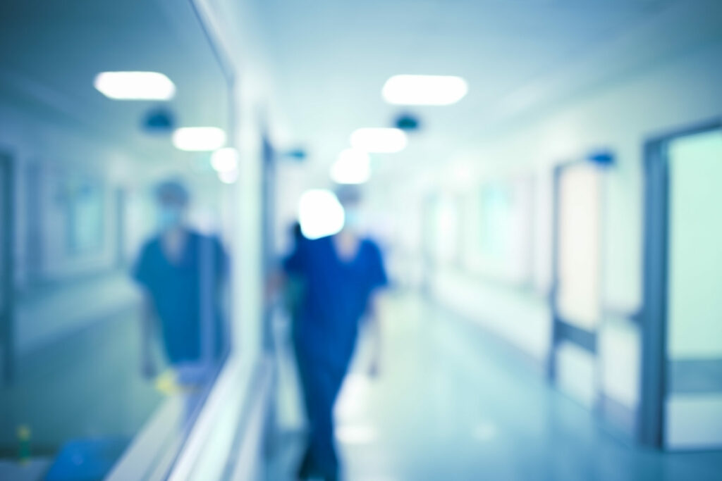 Medical worker in the hospital hall, unfocused background